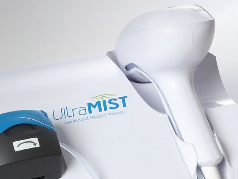 UltraMIST non-contact low-frequency ultrasound console with its handpiece and saline mist applicator